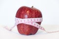 Red apple and measurement tape