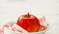 Red apple with measurig tape, weigh loss concept Royalty Free Stock Photo