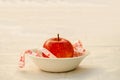 Red apple with measurig tape, weigh loss concept Royalty Free Stock Photo