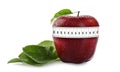 Red apple with measuring tape on white background. Slimming, weight loss concept Royalty Free Stock Photo
