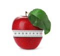 Red apple with measuring tape on white background. Slimming, weight loss concept Royalty Free Stock Photo