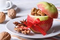 Red apple with nuts and raisins and coffee on the table Royalty Free Stock Photo