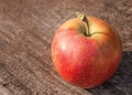 Red apple on old wooden table Royalty Free Stock Photo