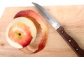 Red apple, peel and knife Royalty Free Stock Photo