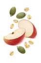 Red apple pieces, green pumpkin seeds and rolled oats isolated on white background. Cereal ingredients Royalty Free Stock Photo