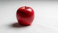 Red apple on a plain white background. The apple is round with a glossy surface, showing subtle Royalty Free Stock Photo
