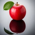 Red apple on a reflective surface, covered with water droplets Royalty Free Stock Photo