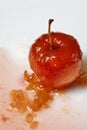Red apple in rose syrup Royalty Free Stock Photo