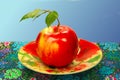 Red apple on a saucer