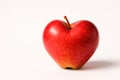 A red apple in the shape of a heart. Space for text. Royalty Free Stock Photo