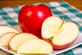 Red apple sliced on plate