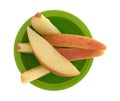 Red apple slices in a small green bowl Royalty Free Stock Photo