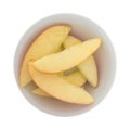 Red apple slices in a small white bowl Royalty Free Stock Photo