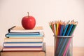 Red apple on stack of book with pencil box Royalty Free Stock Photo