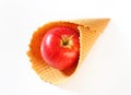 Red apple in waffle cornet Royalty Free Stock Photo