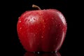 a red apple with water droplets on it