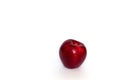 Red apple in water drops isolated on a white background