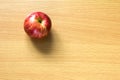 Red apple on wood background Royalty Free Stock Photo
