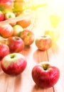 Red apples in basket on wooden table background. Fresh autumn harvest. Rustic style. Selective focus Royalty Free Stock Photo