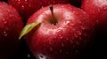 Red apples close-up. Fresh red apples on a black texture background. Apple with droplets of water. Healthy food for vegetarians. Royalty Free Stock Photo