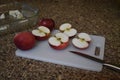 Red apples on a cutting board to be ingredients in a pie or cobbler in autumn Royalty Free Stock Photo