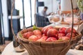 Red apples in a fruit basket with a slightly blurred background, as if they were in a hotel dining room Royalty Free Stock Photo