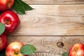 Red Apples with Green Leaves on Wooden Table Royalty Free Stock Photo