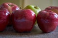 Red apples and a green one Royalty Free Stock Photo