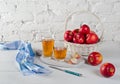 Red apples, juice in glasses, blue napkin and a knife Royalty Free Stock Photo