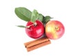 red apples with leaves and cinnamon sticks on white isolated background Royalty Free Stock Photo