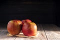 Red apples placed on a wooden table healthy fruits black and dark wood background