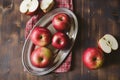 Red apples on plank wooden table Royalty Free Stock Photo