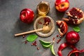 Red apples, pomegranate and honey on a dark rustic background. New Year - Rosh Hashanah.Traditional Jewish food. Top view, copy