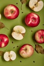 red apples with slices and leaves isolated on green background top view. Royalty Free Stock Photo