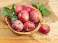 Red apples with twigs in the vintage wooden fruit bowl Royalty Free Stock Photo