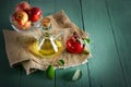 Red apples in vase and apple cider vinegar on wooden table. Concept - healthy food from your garden. Top view. Royalty Free Stock Photo