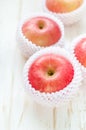 Red Apples on white wooden table Royalty Free Stock Photo