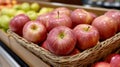 Red apples in a wicker basket at a grocery store display. Royalty Free Stock Photo