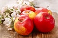 Red apples on wooden table