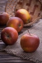 Red apples on wooden table, selective focus