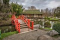 Red arch bridge in public japanese garden in Toulouse Royalty Free Stock Photo