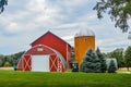 Red Arched Barn with Orange Twin Silos Royalty Free Stock Photo