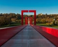 The red arches of the bridge over blue sky background