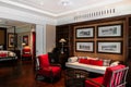 Red armchairs and couch seat in Asian comtemporary living area in resort style bedroom