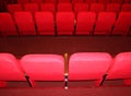 red armchairs. Empty concert hall, theater chairs background ... color photo, empty cinema or concert hall. The red