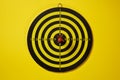 Red arrow dart hitting the center of the target dartboard Royalty Free Stock Photo