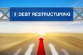 Red arrow and debt restructuring on blue road sign