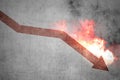 Red arrow down with explosion effect on the wall Royalty Free Stock Photo