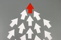 Red arrow leads many white arrows, a leadership concept Royalty Free Stock Photo