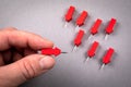 Red arrow in a man& x27;s hand. Follow, leader, social media and development concept Royalty Free Stock Photo